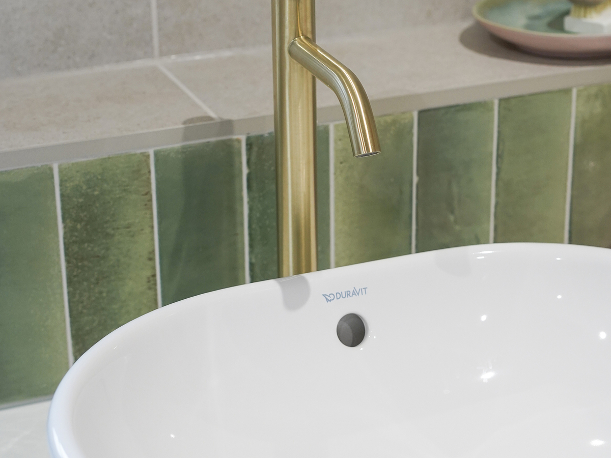 Minimal floating sink gold tap