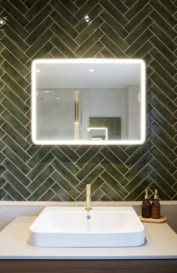 Green tiled bathroom light up mirror