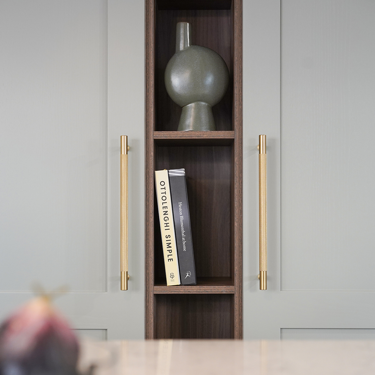 Storage solutions contasting materials gold finishes